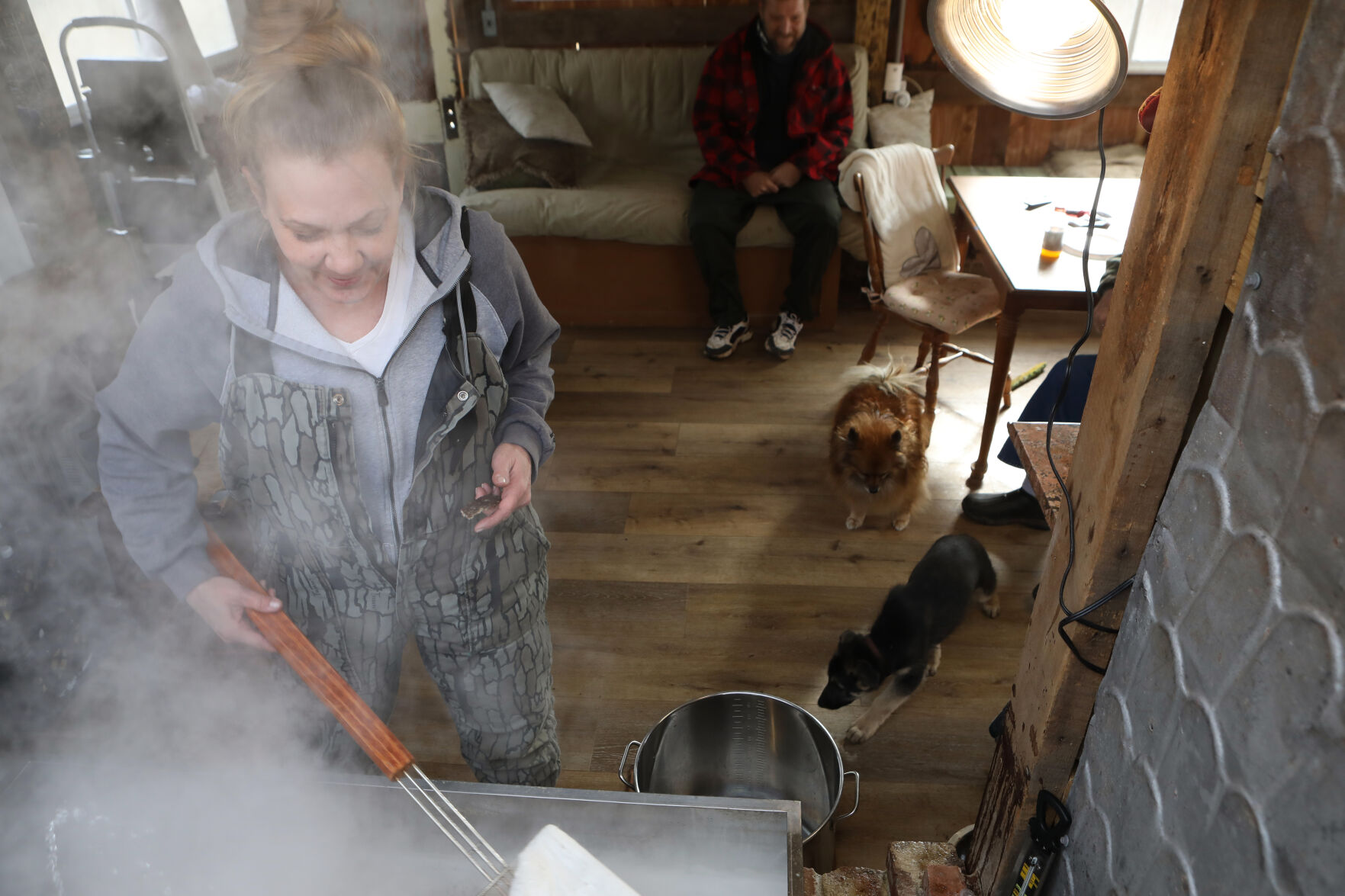 Cheryl Vieth skims maple sap